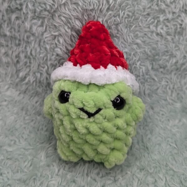frog wearing red christmas hat